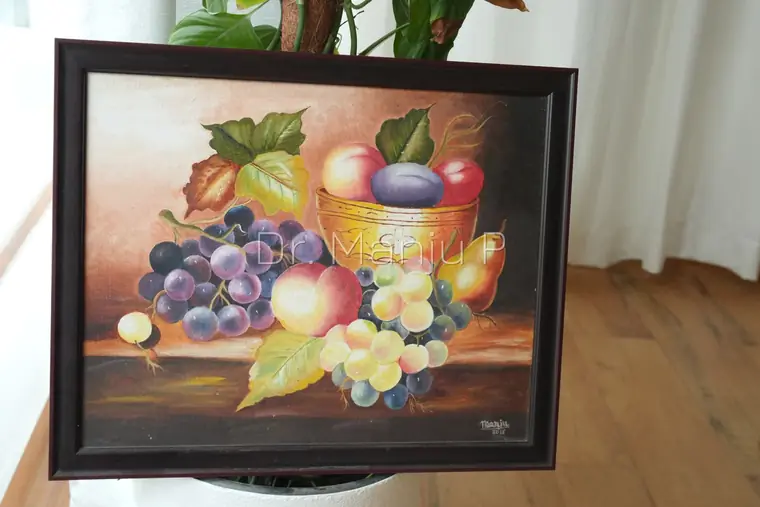 Still Life with Fruit and Brass Bowl — Kerala mural painting on canvas by Dr. Manju P: Grapes, peach, plum and pear gathered around a gold bowl on a dark ledge