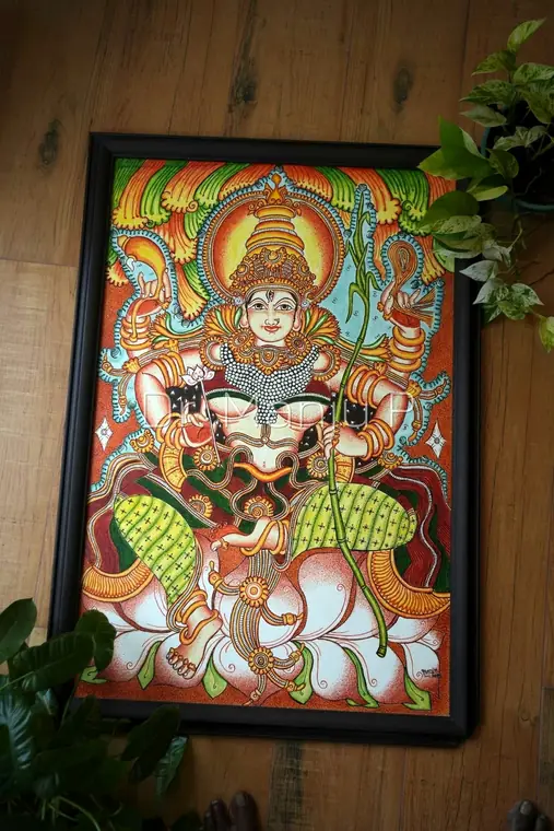 Devi with the Sugarcane Bow — Kerala mural painting on canvas by Dr. Manju P: The four-armed goddess sitting on a full bloomed lotus, with a sugarcane bow on one hand .