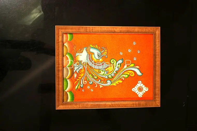 The Mural Bird — Kerala mural detail: The panel close up — feather ruling, scallop border and the white kolam emblem