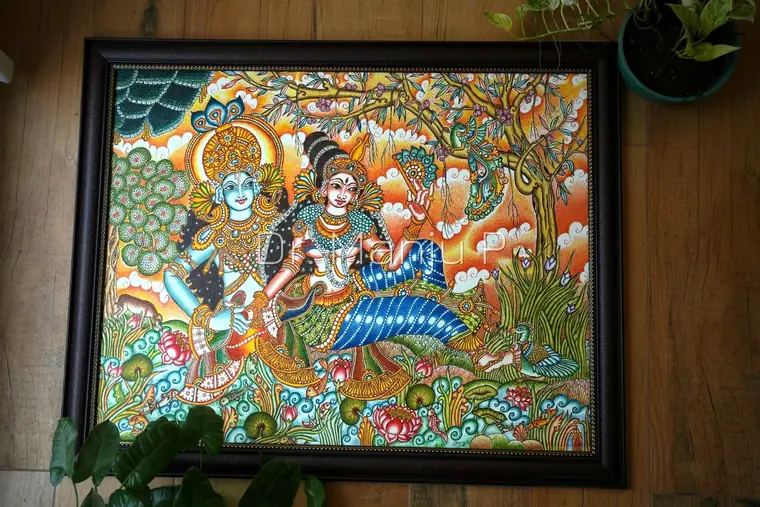 KRISHNA and RADHA by the Lotus Pond — Kerala mural painting on canvas by Dr. Manju P: Lord Krishna and his beloved Radha at the water's edge, under a flowering tree