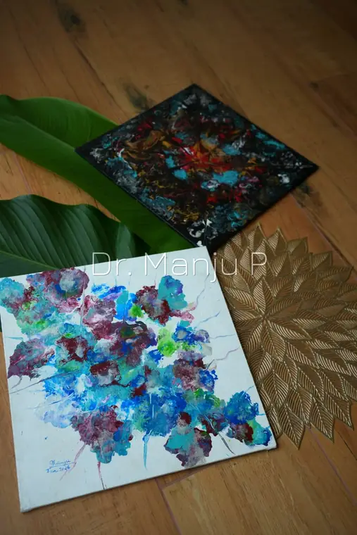 Two Abstracts on Small Canvas — Kerala mural painting on canvas by Dr. Manju P: A dark bloom and a white-ground bloom — colour let loose off the temple wall