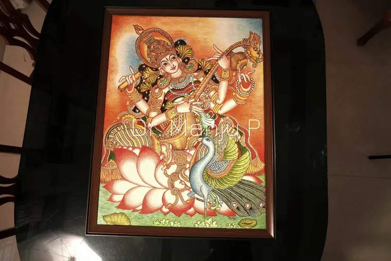 Saraswati on the Lotus — Kerala mural painting on canvas by Dr. Manju P: The four-armed goddess of learning, veena in hand, her peacock beside her