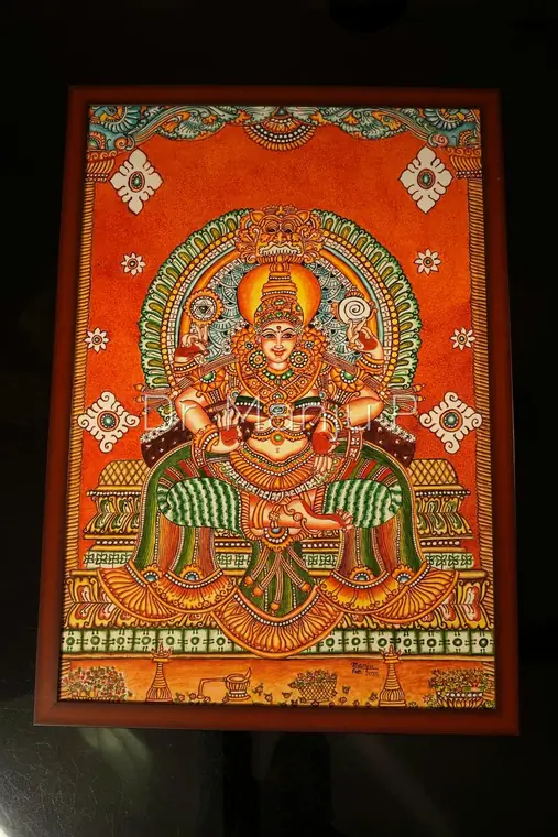 MOOKAMBIKA  Devi Enthroned Beneath the Kirtimukha — Kerala mural painting on canvas by Dr. Manju P: The four-armed goddess sitting on a peedam with conch and chakra raised, under a lion-face arch