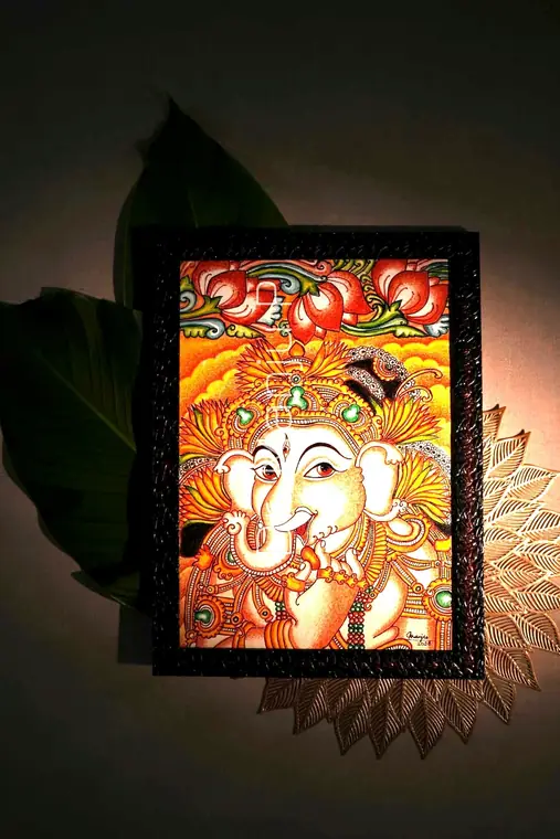 Ganapati in the Lotus Light — Kerala mural detail: Under a single warm lamp, beside a brass lotus leaf-plate