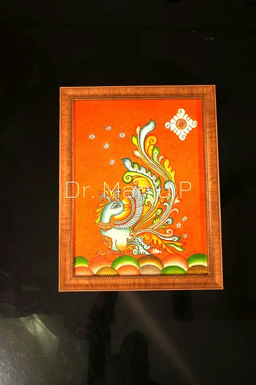 The Mural Bird — Kerala mural painting on canvas by Dr. Manju P: A single stylised bird dissolving into leaf and scroll on a vermilion field